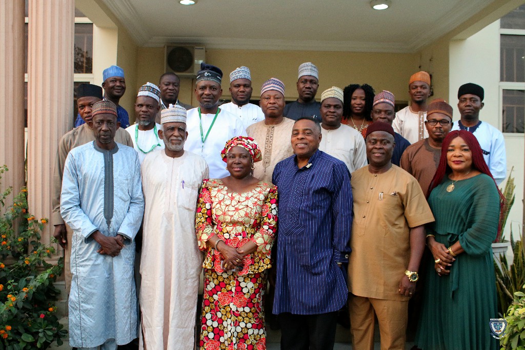 Members of the Second Governing Council of Federal University Lokoja in a group photograph with the Council Secretariat